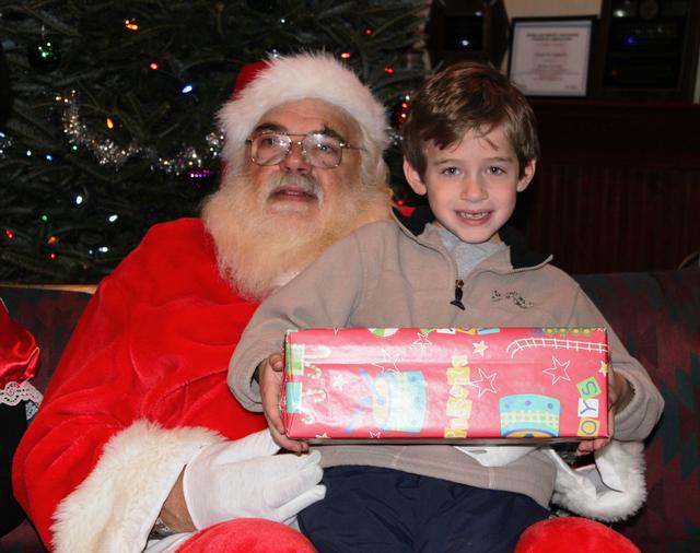 Children's Christmas Party at 8-100. 12-9-2012. Santa pays a visit . Photo by Vincent P. Tuzzolino